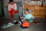 Boy and his new Christams Toys, Crane, Books, Father, Son, December 1959, 1950s