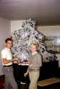 Woman, Man, decorating a Frosted Tree on a piano, Decorations, Ornaments, 1960s