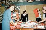 wrapping presents, women, fun, funny, party, 1950s