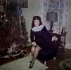 Pretty Smiling, Woman sits, RHT stockings, lamp, tree, 1940s, PHCV04P08_18
