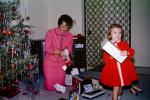 Mother and Daughter unwrapping presents, 1950s