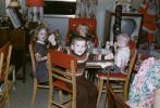 Children at the kids table, boy, girls, television, 1950s