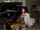 Girl with her Golden Pedal Car, toy, 1950s