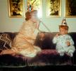 Mother, Son, Sofa, Couch, jammies, birthday hats, 1950s, Mom and Son partying, noisemaker, Robe, Pajama, party hat, cap, nightwear, PHNV01P01_03
