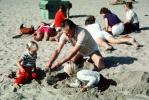 Grandpa Playing in the sand with grandaughters, Laguna Beach, PKFV02P11_14