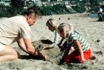 Grandpa Playing in the sand with grandaughters, Laguna Beach, PKFV02P11_19