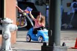 Girl on a Push Cart