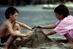 boys building a sandcastle