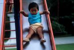 Toddler Sliding on a Slide