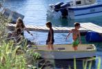 small rowboat, docks, water, boy, girls, Noumea, New Caledonia