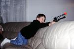 Boy with a gun, pistol