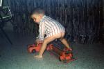 Boy playing with toy truck, funny, hilarious
