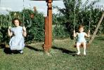 Swing, 1950s, Backyard, lawn, grass, PLGV03P09_02