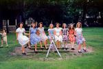 Teeter-totter, Balance, Sitting, Girls, fromal dress, August 1947, 1940s