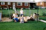 Backyard, sandbox, boys, girls, slide, July 1958, 1950s, PLGV03P14_19