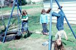 swingset, upside down, girls, backyard, April 1979, 1970s