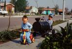 Casey Jones the Kid, Following a tricycle boy, sidewalk, 1950s, PLGV04P05_04
