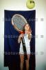 Girl with Oversize Tennis Racquet and Tennis Ball