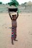 African Boy Carries Baskets