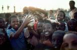 Children holding up an Ostrich Egg, smiles, funny, fun, Exuberance, PLPV04P11_10