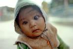 Baby staring, bittersweet contemplation of the future, hoody, Kathmandu, Nepal, PLPV08P02_15