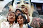 Girls with a statue of Buddha, Kathmandu