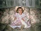 Little Girl sitting on a Sofa in a Hat, 1950s, PLPV11P13_14