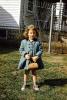 Little Girl with a purse, backyard, coat, cold, 1950s, PLPV11P14_08