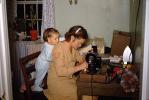 Vicky looks over Moms Shoulder, Sewing Machine, Hug, adorable, 1950s, PLPV15P06_13