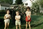Siblings in the Summer, outdoors, 1950s