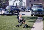 Boy in Stroller, cars, 1950s