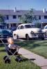 Boy in Stroller, cars, 1950s