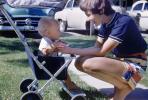 Mother with Boy in Stroller, cars, 1950s