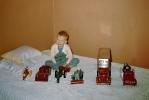 Boy and his toy cars, Jeep, tractor, PIE Express, Bed, collection, 1950s, PLTV01P03_03