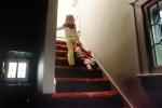 Girl walking upstairs with a Doll, PLTV01P06_04B