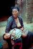 Woman nursing her baby, In the Himalayas in Nepal, Araniko Highway, PMCV02P08_05.0214