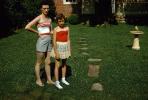 Mother and Daughter, backyard, lawn, grass, birdbath, 1950s, PMCV04P03_01