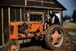 Mother and Daughter, Case Farm Tractor, 1950s