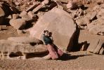 Navajo Woman with Baby, sandstone boulders, Sand, Desert, PMCV04P04_04