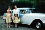 Mother, Father, Daughters, Oldsmobile Car, dresses, vehicle, automobile, 1950s, PORV13P01_15