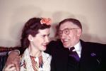 Man and Woman smiling, laughing, flower, 1940s, PORV14P09_01