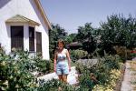Woman in her Garden, shorts, backyard