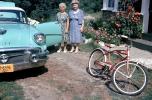 Two women, friends, buick car, 1950s