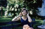 Smiling Woman, backyard, bench, swimsuit, 1960s, PORV26P15_17