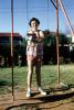 Swing Set, girl, smiles, backyard, 1950s, PORV27P02_10