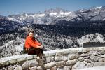 Woman sitting on a wall, sweater, mountains, 1950s, PORV27P03_09