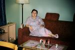 Woman, dress, couch, overweight, Adak Alaska, 1940s