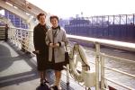 Women, coats, Ocean Liner Cruise, SS-United States, pier, harbor, smiles, August 1960, 1960s, PORV29P14_03