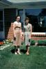 Mother and Daughter, front yard, 1950s