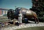 Woman in front of a Buffalo Statue, bull, Motel, 1950s, PORV30P05_07